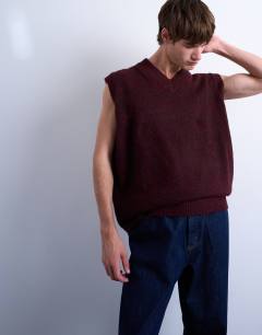 Model wearing Oversized fit knitted v-neck tank in burgundy