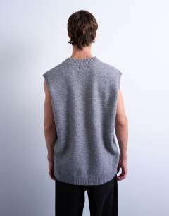 Model wearing Oversized fit knitted v-neck tank in grey