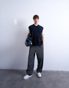 Model wearing Oversized fit knitted v-neck tank in navy