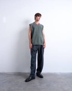 Model wearing Oversized fit knitted v-neck tank in sage green