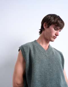 Model wearing Oversized fit knitted v-neck tank in sage green