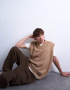 Model wearing Oversized fit knitted v-neck tank in stone