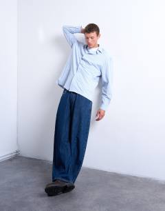 Model wearing Oversized fit long sleeve stripe shirt in light blue & yellow