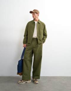Model wearing Oversized fit nylon ripstop harrington jacket in green