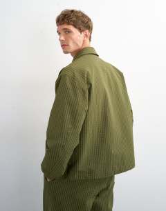 Model wearing Oversized fit nylon seersucker harrington jacket in green