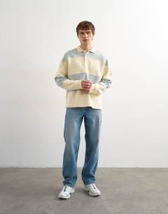 Model wearing Oversized fit rugby polo sweatshirt in blue and cream