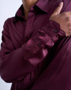 Model wearing Oversized fit sateen shirt in burgundy