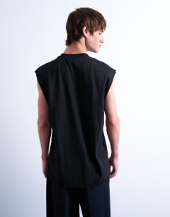 Model wearing Oversized fit sleeveless t-shirt in black