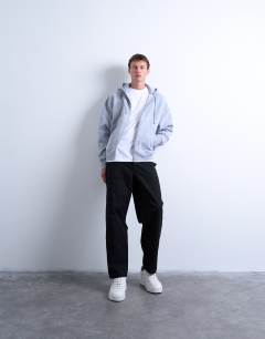 Model wearing Oversized fit sleeveless t-shirt in white