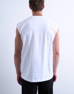 Model wearing Oversized fit sleeveless t-shirt in white