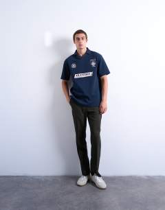 Model wearing Oversized fit sports polo shirt with Marseille back embroidery in navy