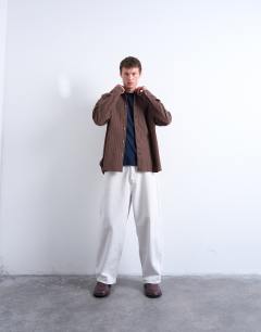 Model wearing Oversized fit stripe oxford shirt in washed brown