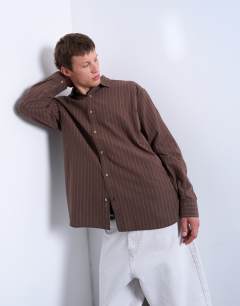 Model wearing Oversized fit stripe oxford shirt in washed brown