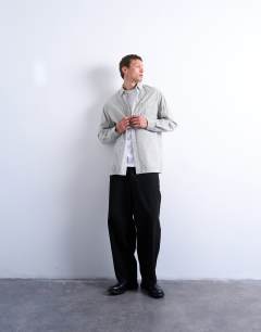 Model wearing Oversized fit stripe shirt in black & ecru