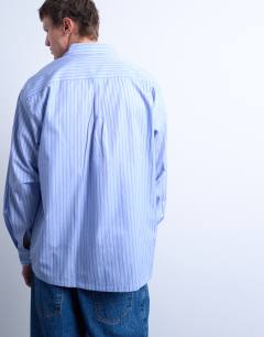 Model wearing Oversized fit stripe shirt in blue