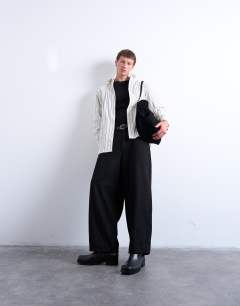 Model wearing Oversized fit stripe shirt in ecru