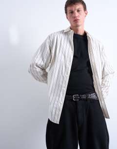 Model wearing Oversized fit stripe shirt in ecru