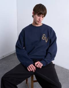 Model wearing Oversized fit sweatshirt with East Village embroidery in navy