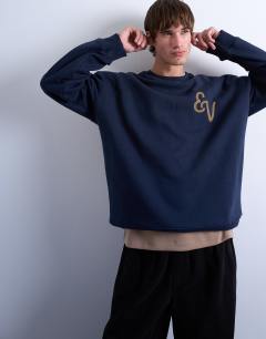 Model wearing Oversized fit sweatshirt with East Village embroidery in navy