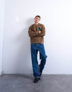 Model wearing Oversized fit sweatshirt with letter embroidery in brown