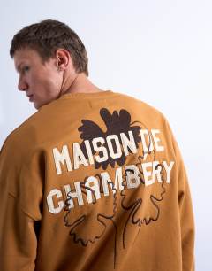 Model wearing Oversized fit sweatshirt with Maison de Chambrey back embroidery in brown