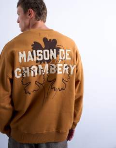 Model wearing Oversized fit sweatshirt with Maison de Chambrey back embroidery in brown