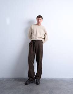 Model wearing Oversized fit sweatshirt with raised floral print in stone