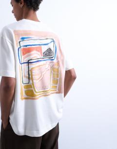 Model wearing Oversized fit t-shirt with abstract block print in ecru