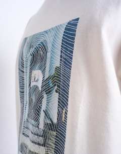 Model wearing Oversized fit t-shirt with doorway image print and embroidery in ecru