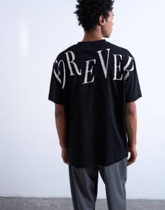 Model wearing Oversized fit t-shirt with Forever embroidery in black