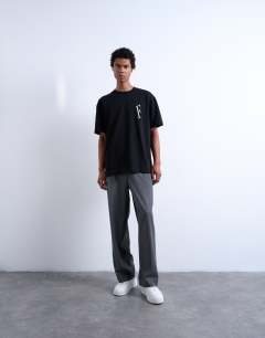 Model wearing Oversized fit t-shirt with Forever embroidery in black
