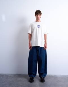 Model wearing Oversized fit t-shirt with front and back Cala Carbo print in ecru