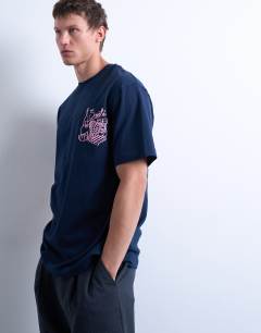 Model wearing Oversized fit t-shirt with front and back fruit and wine print in navy