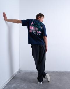 Model wearing Oversized fit t-shirt with front and back fruit and wine print in navy