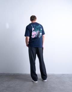 Model wearing Oversized fit t-shirt with front and back fruit and wine print in navy