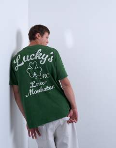 Model wearing Oversized fit t-shirt with front and back lucky print in washed green
