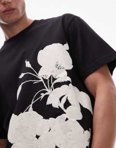Model wearing Oversized fit t-shirt with mono floral print in black