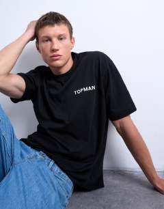 Model wearing Oversized fit t-shirt with Topman front & back print in black