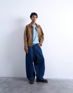 Model wearing Oversized fit t-shirt with Vermont Phys Ed embroidery in washed blue
