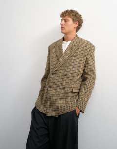 Model wearing Oversized fit textured check double breasted blazer with wool blend in brown