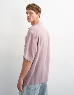 Model wearing Oversized fit textured cheesecloth short sleeve shirt in washed lilac