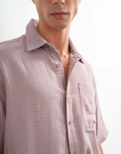 Model wearing Oversized fit textured cheesecloth short sleeve shirt in washed lilac