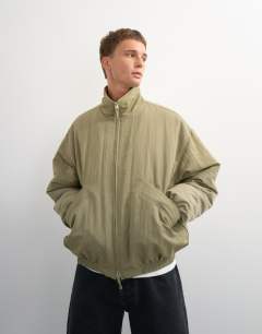 Model wearing Oversized fit twill nylon funnel neck bomber jacket in khaki