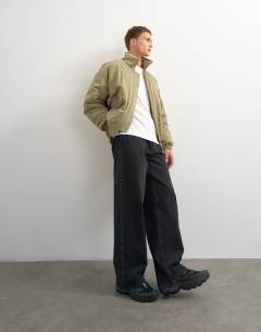 Model wearing Oversized fit twill nylon funnel neck bomber jacket in khaki