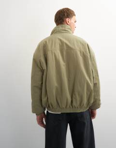 Model wearing Oversized fit twill nylon funnel neck bomber jacket in khaki
