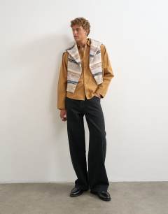 Model wearing Oversized fit utility shirt in tan