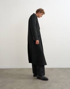 Model wearing Oversized fit wool mix boucle double breasted overcoat in black