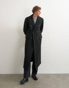 Model wearing Oversized fit wool mix boucle double breasted overcoat in black