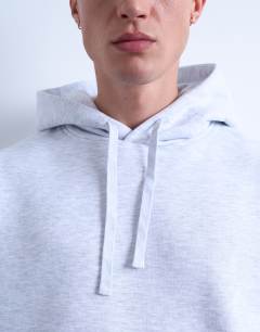 Model wearing Oversized hoodie in light grey marl