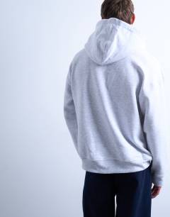 Model wearing Oversized hoodie in light grey marl